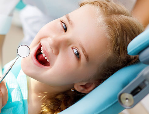 Girl in dental chair - Pediatric Dentist in Bayside, NY